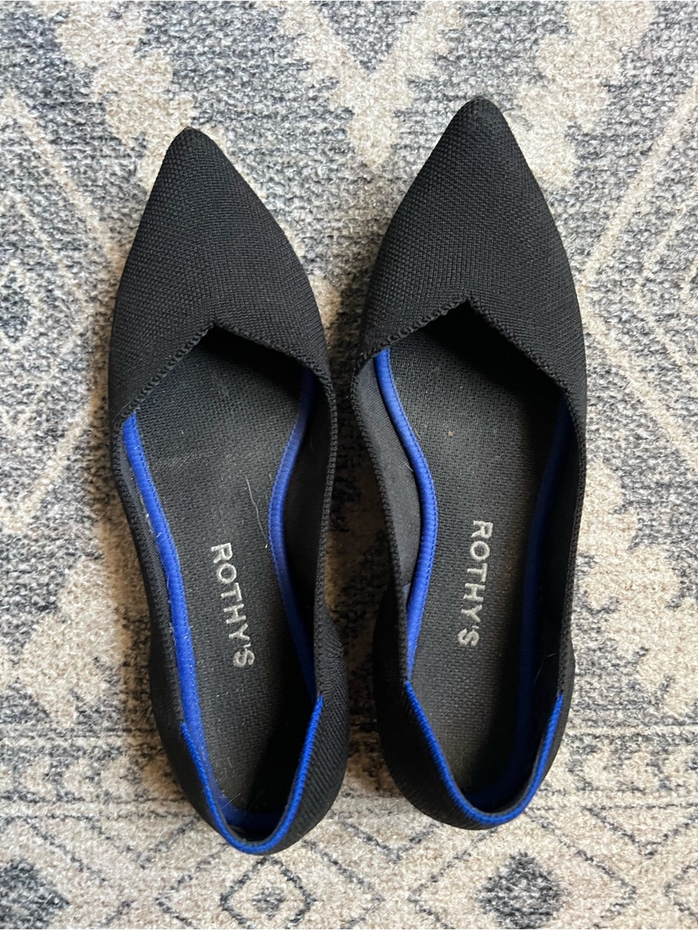 Rothy's Black Pointed Flats with Blue Trim